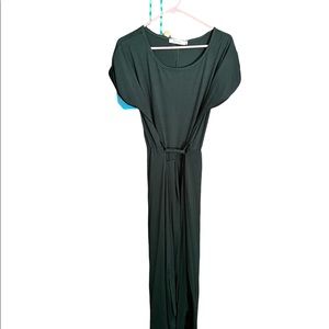 Women’s long, short sleeved, green dress with a tie.